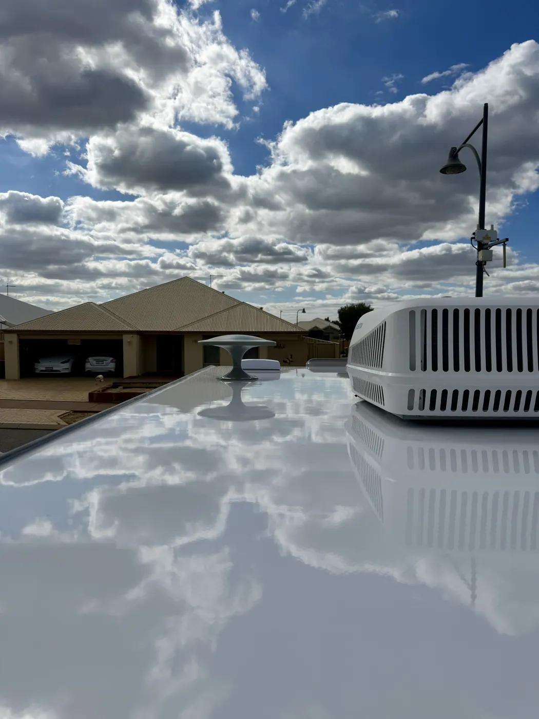 Caravan roof cleaning result Perth — reflective clean finish
